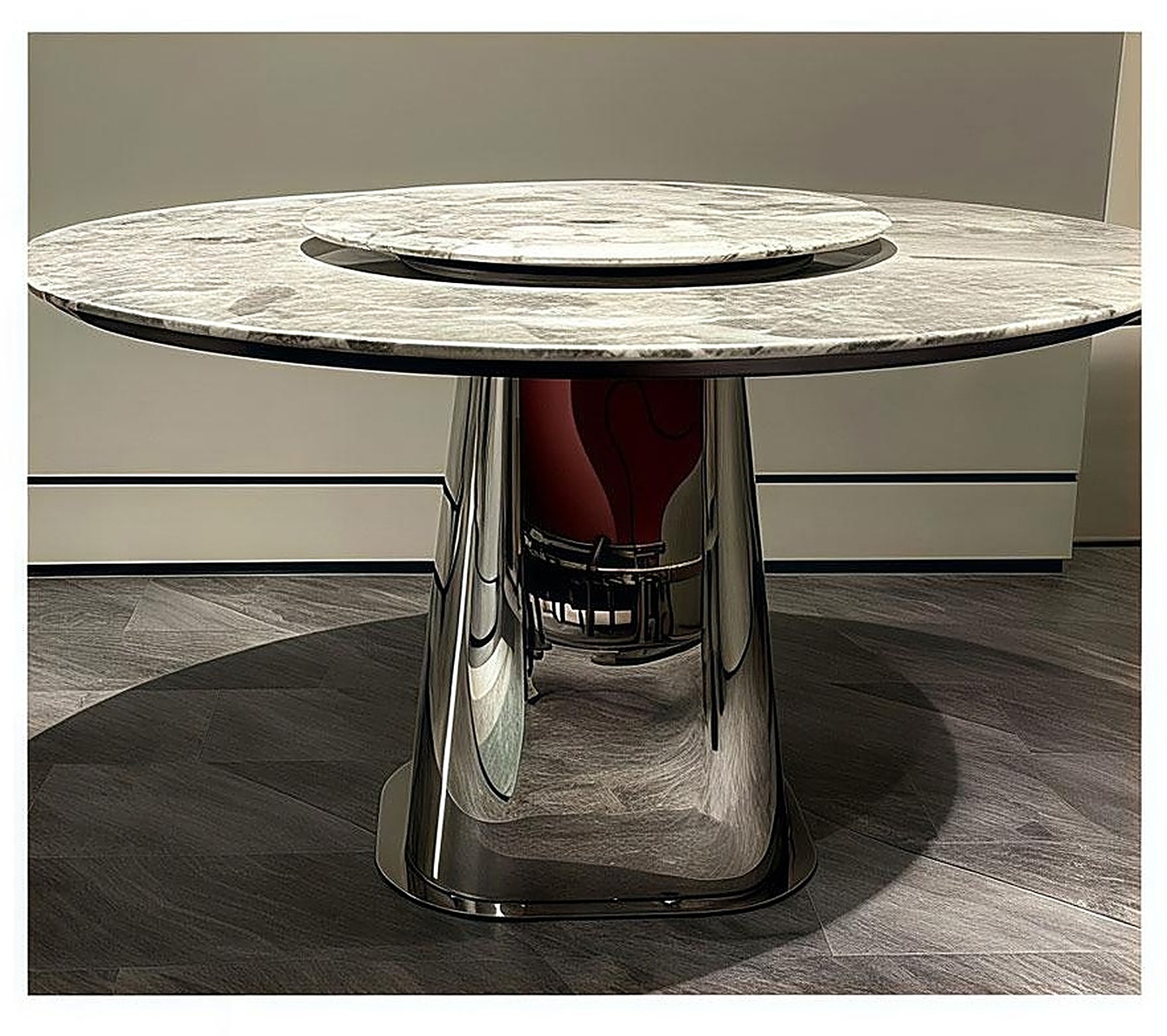 Orbita Grigio — Grey marble top, mirror-polish steel cone