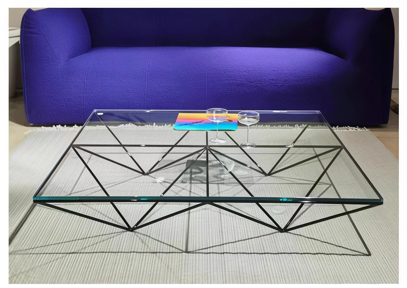Prisma Glass Table — Tempered clear glass, blackened steel rod frame